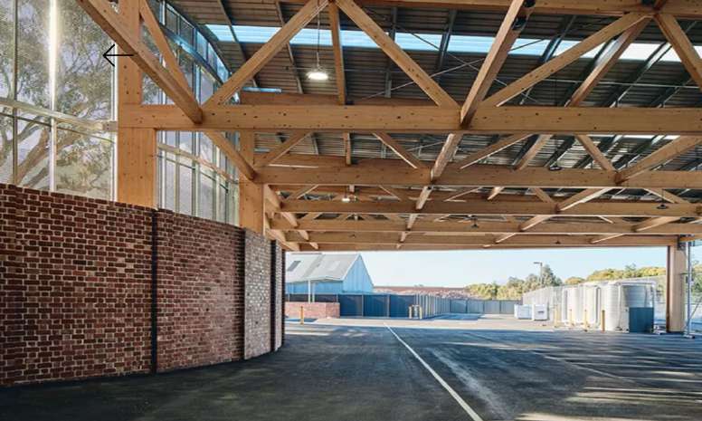 Glulam timber trusses spanning the ground-floor undercroft